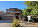 Charming two-story home featuring a well-maintained front yard and attached two-car garage at 2934 W Peggy Dr, San Tan Valley, AZ 85144