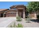 Charming two-story home featuring a well-maintained front yard and a two-car garage at 2934 W Peggy Dr, San Tan Valley, AZ 85144