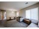 Spacious living room with neutral walls, plush carpet, and cozy furniture, and plenty of natural light at 2934 W Peggy Dr, San Tan Valley, AZ 85144