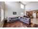 Expansive living room with vaulted ceilings, hardwood floors, and a large sectional sofa in an open layout at 2934 W Peggy Dr, San Tan Valley, AZ 85144
