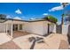 Home exterior with a covered patio and easy access to backyard at 3008 S Saguaro Cir, Mesa, AZ 85202