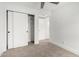 Cozy bedroom with neutral carpet, white sliding door closet, and natural light at 3008 S Saguaro Cir, Mesa, AZ 85202