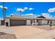 Wide driveway leading to a home with minimalist landscaping, perfect for easy upkeep at 3008 S Saguaro Cir, Mesa, AZ 85202