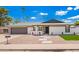 Well-maintained single-story home with desert landscaping and modern design elements at 3008 S Saguaro Cir, Mesa, AZ 85202