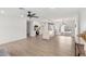 Bright open-concept kitchen and living area with modern finishes and light-colored wood flooring at 3008 S Saguaro Cir, Mesa, AZ 85202