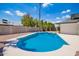 Inviting pool with a spacious deck, set within a private backyard oasis at 3008 S Saguaro Cir, Mesa, AZ 85202