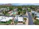 Scenic aerial view of a residential community with swimming pools and beautiful mountain views in the background at 34 E Boca Raton Rd, Phoenix, AZ 85022