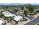 Breathtaking aerial view of a desert home showcasing its solar panels and proximity to a community pool at 34 E Boca Raton Rd, Phoenix, AZ 85022