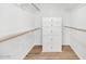 Well-organized walk-in closet with chest of drawers, providing lots of storage space at 34 E Boca Raton Rd, Phoenix, AZ 85022