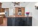 Open-concept kitchen featuring wood cabinets, stainless steel appliances, and a central island at 34 E Boca Raton Rd, Phoenix, AZ 85022