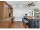 Spacious kitchen with wood cabinets, a granite countertop, an island with seating and stainless steel appliances at 34 E Boca Raton Rd, Phoenix, AZ 85022
