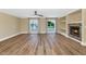 Bright living room features wood floors, built-in shelves, fireplace, and sunlit windows at 34 E Boca Raton Rd, Phoenix, AZ 85022