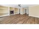 Spacious living room with wood floors, built-in shelves, decorative fireplace and ample natural light at 34 E Boca Raton Rd, Phoenix, AZ 85022