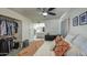 Bright bedroom with ceiling fan, closet, and adjacent bathroom at 3600 N Hayden Rd # 2310, Scottsdale, AZ 85251