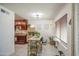 Bright and airy dining area with a charming light fixture, natural light, and seamless flow to the kitchen at 3600 N Hayden Rd # 2310, Scottsdale, AZ 85251