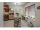 Bright dining area with sleek tile floors, open to the kitchen, and large windows for plenty of natural light at 3600 N Hayden Rd # 2310, Scottsdale, AZ 85251