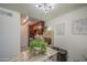 Open kitchen and dining area with stainless steel appliances and ample storage, decorated with modern art at 3600 N Hayden Rd # 2310, Scottsdale, AZ 85251