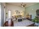 Stylish living room with a ceiling fan, hardwood floors, and balcony access for relaxed, easy living at 3600 N Hayden Rd # 2310, Scottsdale, AZ 85251