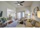 Inviting living room with ceiling fan, sleek hardwood floors, and a comfy sofa, creating a relaxing space at 3600 N Hayden Rd # 2310, Scottsdale, AZ 85251