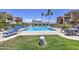 This is a community pool surrounded by tables with chairs and palm trees at 3600 N Hayden Rd # 2310, Scottsdale, AZ 85251