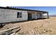 View of the back side of a home under construction showing windows and a sliding glass door at 37459 W Missouri Ave, Tonopah, AZ 85354