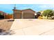 Charming single-story home featuring a spacious driveway and a two-car garage at 4064 E Reins Rd, Gilbert, AZ 85297