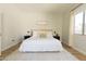 Spacious main bedroom with wood floors, a plush rug, and decoratively pillowed king size bed at 4064 E Reins Rd, Gilbert, AZ 85297