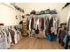 Large walk-in closet with built-in shelving, rods, and ample storage space for clothes and accessories at 4064 E Reins Rd, Gilbert, AZ 85297