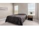 Neutral bedroom featuring two windows for natural light, carpet flooring, and simple decor at 40918 W Hillman Dr, Maricopa, AZ 85138
