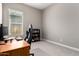 Bright bedroom featuring a gamer chair at the desk and a bookcase at 40918 W Hillman Dr, Maricopa, AZ 85138