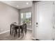 Dining area with seating for four, bright natural light, and a view to the exterior at 40918 W Hillman Dr, Maricopa, AZ 85138