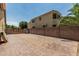 Large backyard with paver area and brick fence at 4318 N 180Th Dr, Goodyear, AZ 85395