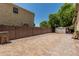 Spacious backyard with paver area, block wall, and a storage shed at 4318 N 180Th Dr, Goodyear, AZ 85395