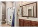 Bathroom with tub/shower combination and wood vanity at 4318 N 180Th Dr, Goodyear, AZ 85395