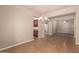 View from dining room to kitchen and living room, showcasing chandelier, tile flooring, and open floor plan at 4318 N 180Th Dr, Goodyear, AZ 85395