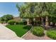 Exterior shot showcasing the landscaping and artificial turf in the front yard on a sunny day at 4318 N 180Th Dr, Goodyear, AZ 85395