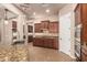 Kitchen with dark wood cabinets, stainless steel appliances, and granite countertops at 4318 N 180Th Dr, Goodyear, AZ 85395