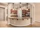Modern kitchen island with granite countertops, stainless steel appliances, and pendant lighting at 4318 N 180Th Dr, Goodyear, AZ 85395