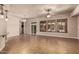 Spacious living room with tile flooring, neutral paint, ceiling fan, and access to the backyard at 4318 N 180Th Dr, Goodyear, AZ 85395