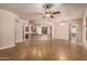 Open concept living room with tile flooring, ceiling fan, and kitchen island at 4318 N 180Th Dr, Goodyear, AZ 85395