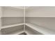 Walk-in pantry with multiple levels of white shelving at 4318 N 180Th Dr, Goodyear, AZ 85395