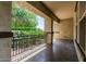 Covered outdoor patio offers a serene view of the backyard and ample space for seating at 4318 N 180Th Dr, Goodyear, AZ 85395