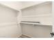 Walk-in closet features built-in shelving for optimal storage at 4318 N 180Th Dr, Goodyear, AZ 85395
