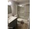 This bathroom features a shower over tub, a nice sink, and is enhanced by wood-look floors at 4329 W Bloomfield Rd, Glendale, AZ 85304