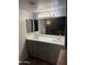 Bathroom with tile floors, vanity with double sinks, soft walls and updated lighting at 4329 W Bloomfield Rd, Glendale, AZ 85304
