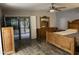The primary bedroom has outdoor access, a ceiling fan, and wood look flooring at 4329 W Bloomfield Rd, Glendale, AZ 85304
