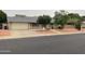 Charming single-story home featuring a well-maintained lawn and a spacious two-car garage at 4329 W Bloomfield Rd, Glendale, AZ 85304