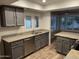 Updated kitchen featuring granite countertops, stainless steel appliances and wood-look flooring at 4329 W Bloomfield Rd, Glendale, AZ 85304