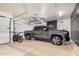Spacious garage with car and overhead storage, offering ample space for vehicles and organization at 4453 S Huachuca Way, Chandler, AZ 85249
