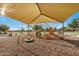 playground with slides and climbing structures under a yellow sunshade at 4453 S Huachuca Way, Chandler, AZ 85249